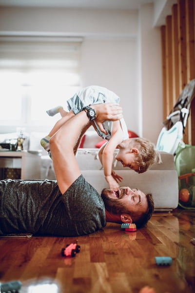 dad holding son in the air