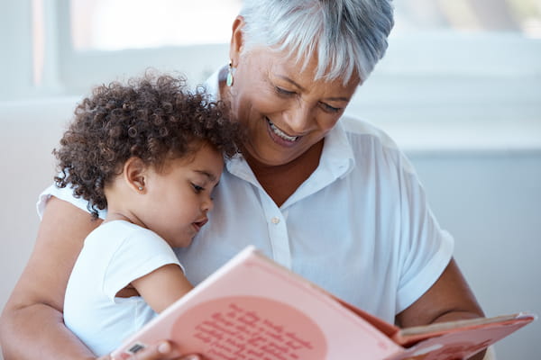 grandma reading to granddaughter